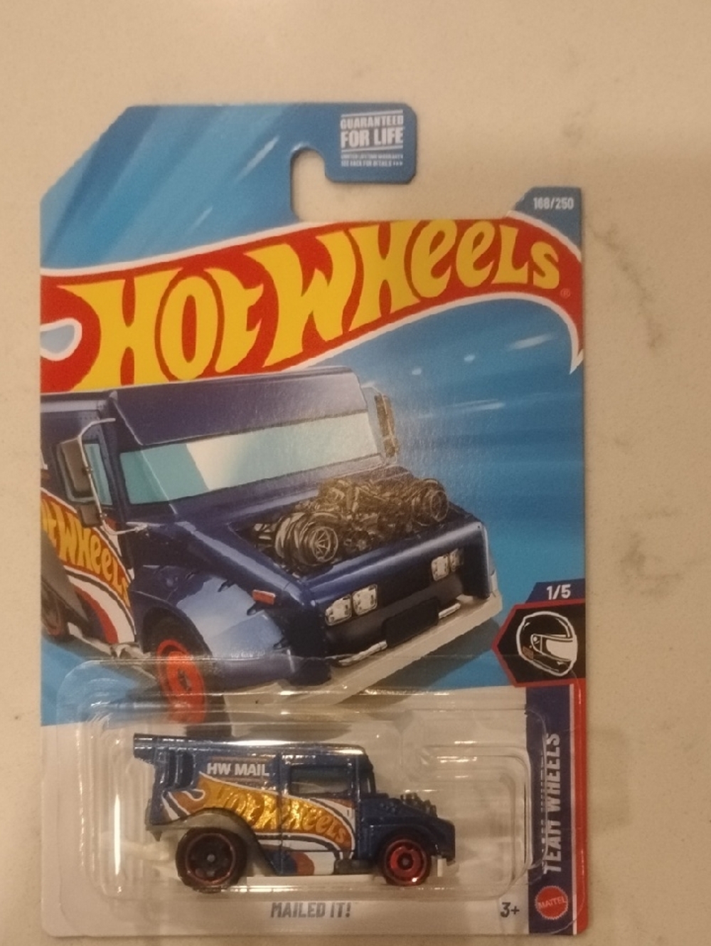 Mattel Hot Wheels HW Mail Truck in Blue with Gold & Red Accents